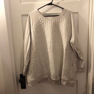 Oatmeal colored sweater with stitched pattern